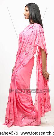 Woman in pink sari looking forward View Large Photo Image Stock Photography - Woman in pink sari looking forward. Fotosearch