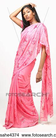 Woman in pink sari View Large Photo Image Picture - Woman in pink sari . Fotosearch