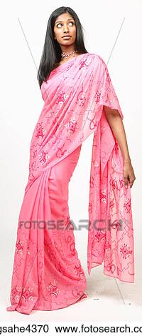 Woman in pink sari View Large Photo Image Stock Image - Woman in pink sari . Fotosearch