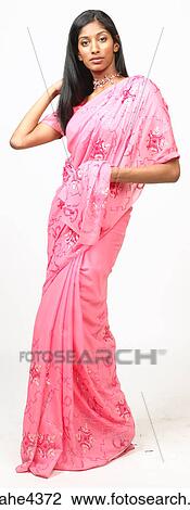 Stock Image - Woman in pink sari . Fotosearch