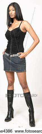 Woman in skirt and black tank top View Large Photo Image Stock Photograph - Woman in skirt and black tank top. Fotosearch