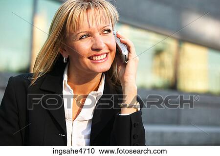 Woman on cell phone View Large Photo Image Stock Image - Woman on cell phone . Fotosearch
