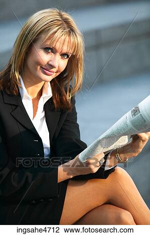 Woman reading newspaper View Large Photo Image Stock Image - Woman reading newspaper . Fotosearch