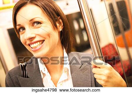 Woman riding subway View Large Photo Image Stock Photo - Woman riding subway . Fotosearch