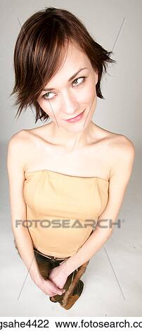 Woman smiling shyly View Large Photo Image Stock Image - Woman smiling shyly . Fotosearch