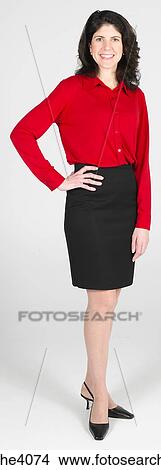 Woman standing and smiling View Large Photo Image Picture - Woman standing and smiling . Fotosearch