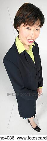 Woman standing and smiling View Large Photo Image Stock Photograph - Woman standing and smiling . Fotosearch