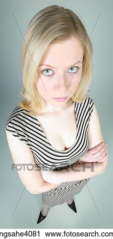 Stock Image - Woman with her arms folded . Fotosearch