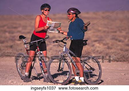 Bikers Looking at a Map View Large Photo Image Stock Photo - Bikers Looking at a Map. Fotosearch