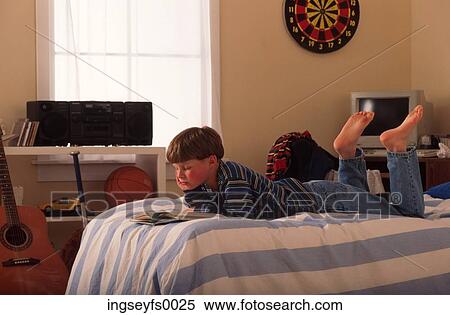 Boy on Bed in Room View Large Photo Image Stock Photography - Boy on Bed in Room. Fotosearch