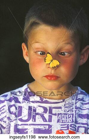 Stock Photo - Boy with Butterfly on his Nose. Fotosearch