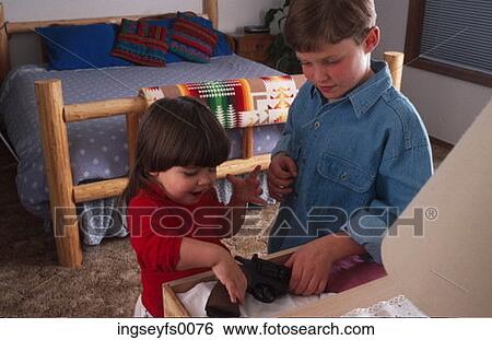 Brother and Sister Playing with a Gun View Large Photo Image Stock Photograph - Brother and Sister Playing with a Gun. Fotosearch