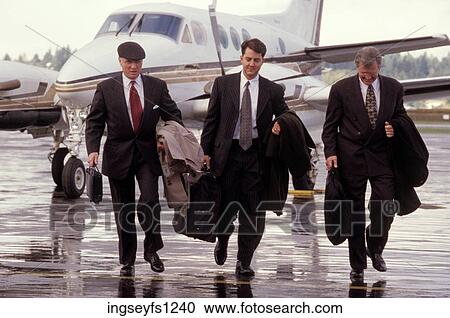 Buisnessmen at the Airport View Large Photo Image Stock Image - Buisnessmen at the Airport. Fotosearch