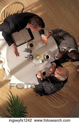 Stock Image - Business Meeting at Restaurant. Fotosearch