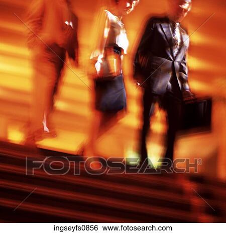 Stock Photograph - Business Professionals Walking Downstairs. Fotosearch
