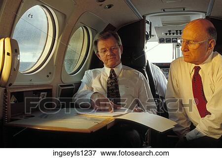 Businessmen on an Airplane View Large Photo Image Stock Photo - Businessmen on an Airplane. Fotosearch