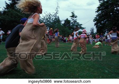 Children Having a Sack Race View Large Photo Image Stock Photograph - Children Having a Sack Race. Fotosearch
