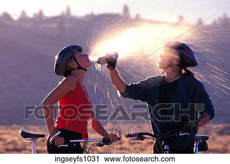 Couple Biking and Playing Around View Large Photo Image Stock Image - Couple Biking and Playing Around. Fotosearch