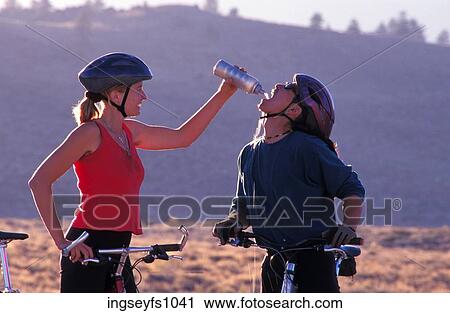 Couple Biking and Playing Around View Large Photo Image Stock Image - Couple Biking and Playing Around. Fotosearch