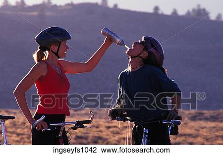 Couple Biking and Playing Around View Large Photo Image Stock Image - Couple Biking and Playing Around. Fotosearch