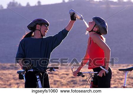 Couple Biking and Playing Around View Large Photo Image Stock Image - Couple Biking and Playing Around. Fotosearch
