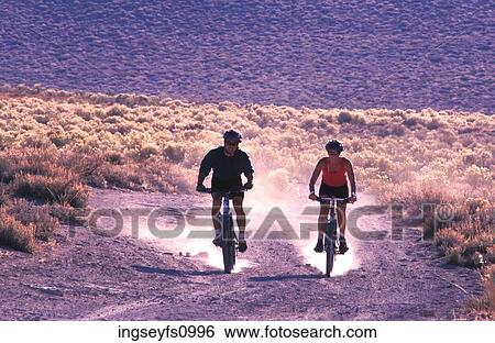 Couple Mountain Biking Together View Large Photo Image Stock Photograph - Couple Mountain Biking Together. Fotosearch