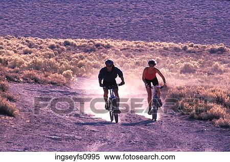 Couple Mountain Biking Together View Large Photo Image Stock Photography - Couple Mountain Biking Together. Fotosearch