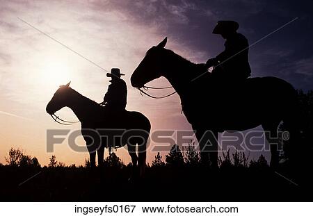 Cowboys at Sunset View Large Photo Image Stock Photo - Cowboys at Sunset. Fotosearch