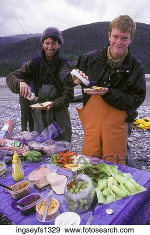Eating a Picnic by the River View Large Photo Image Stock Photo - Eating a Picnic by the River. Fotosearch