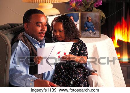 Father and Daughter Looking at Card View Large Photo Image Stock Photo - Father and Daughter Looking at Card. Fotosearch