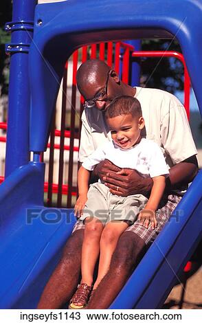 Stock Image - Father and Son on Slide. Fotosearch
