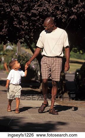 Father and Son Walking Together View Large Photo Image Stock Photograph - Father and Son Walking Together. Fotosearch