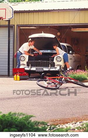 Father and Son Working on Car View Large Photo Image Picture - Father and Son Working on Car. Fotosearch