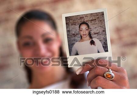 Stock Photo - Girl and Her Picture. Fotosearch
