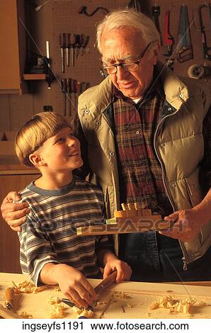 Grandfather Helping Grandson in Wood Shop View Large Photo Image Stock Image - Grandfather Helping Grandson in Wood Shop. Fotosearch