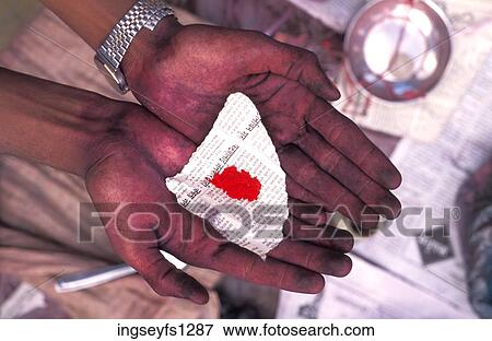Hands Holding Red Powder in Arabic Newspaper View Large Photo Image Stock Photo - Hands Holding Red Powder in Arabic Newspaper. Fotosearch