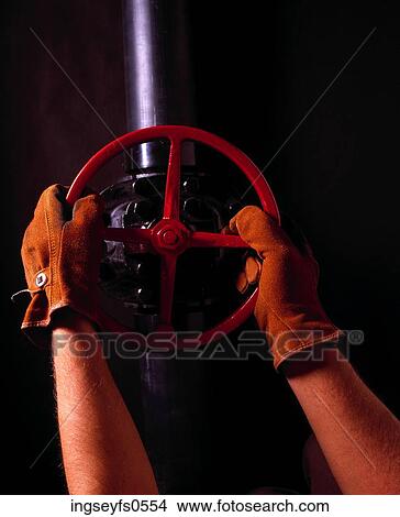 Hands On A Valve Wheel View Large Photo Image Picture - Hands On A Valve Wheel. Fotosearch