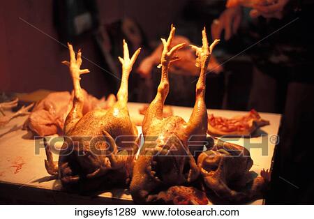 Stock Photo - Headless Chickens on Butcher Block. Fotosearch