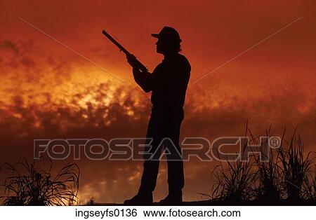 Hunter at Sunset View Large Photo Image Stock Photograph - Hunter at Sunset. Fotosearch