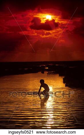In the Ocean at Sunset View Large Photo Image Stock Image - In the Ocean at Sunset. Fotosearch