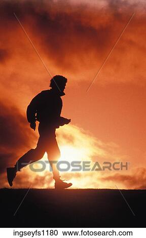 Stock Image - Jogging at Sunset. Fotosearch