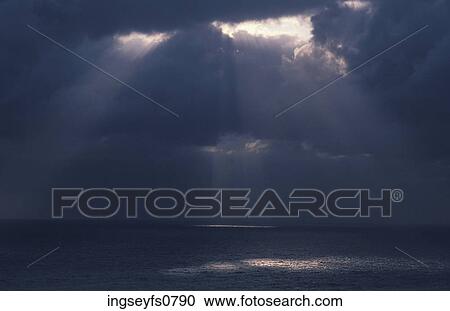 Light Shining Through Clouds onto the Ocean View Large Photo Image Stock Image - Light Shining Through Clouds onto the Ocean. Fotosearch