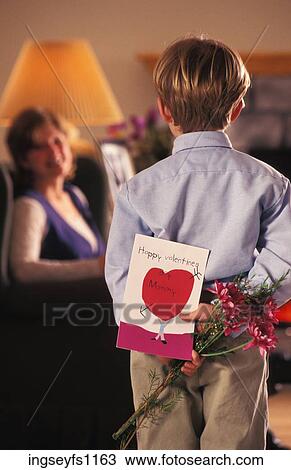 Little Boy Giving Valentine to Mom View Large Photo Image Stock Image - Little Boy Giving Valentine to Mom. Fotosearch