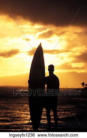 Man and Surfboard at Sunset View Large Photo Image Stock Photograph - Man and Surfboard at Sunset. Fotosearch