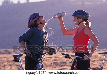 Man and Woman Biking and Playing Around View Large Photo Image Picture - Man and Woman Biking and Playing Around. Fotosearch