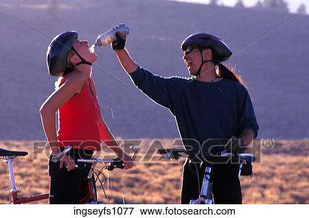 Man and Woman Biking and Playing Around View Large Photo Image Stock Photo - Man and Woman Biking and Playing Around. Fotosearch