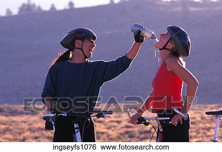 Man and Woman Biking and Playing Around View Large Photo Image Stock Photograph - Man and Woman Biking and Playing Around. Fotosearch