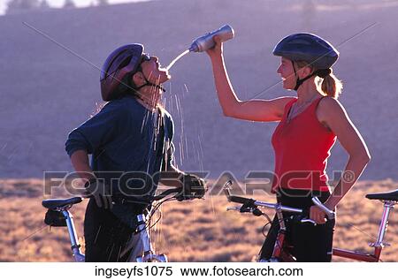 Man and Woman Biking and Playing Around View Large Photo Image Stock Photography - Man and Woman Biking and Playing Around. Fotosearch