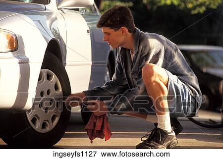 Man Checking Tire Pressure View Large Photo Image Stock Photo - Man Checking Tire Pressure. Fotosearch