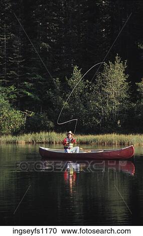 Man Fishing in Canoe View Large Photo Image Stock Image - Man Fishing in Canoe. Fotosearch